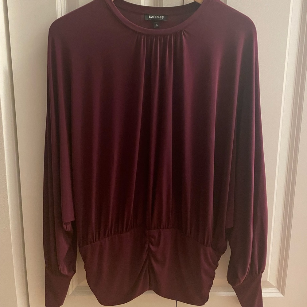 Gorgeous Draped Crew Neck Pleated Banded Bottom Top.